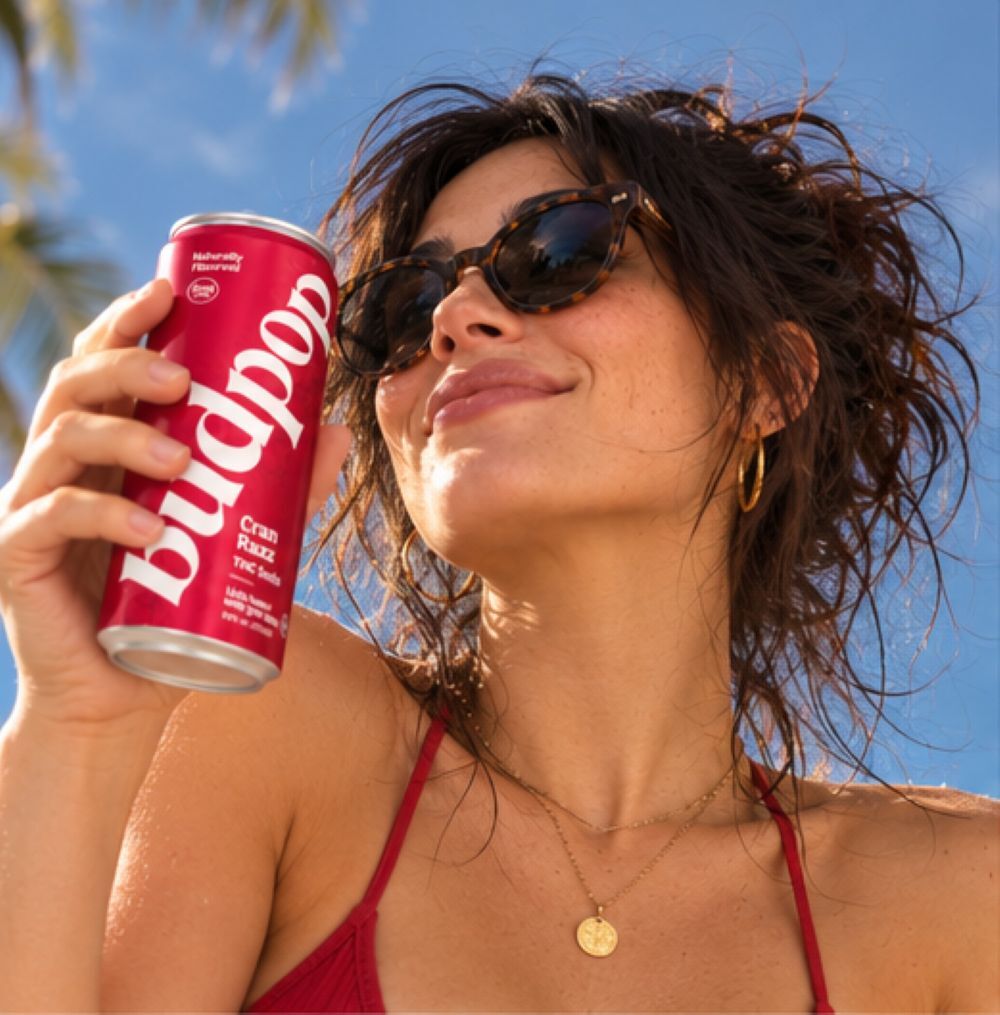 Cran Razz THC Soda low angle shot of Shannyn holding budpop cran razz thc soda